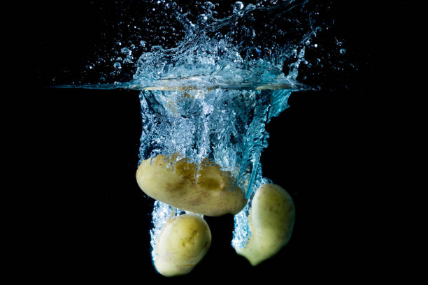 istock Small Salad New Potatos Droped Into Water 684796220