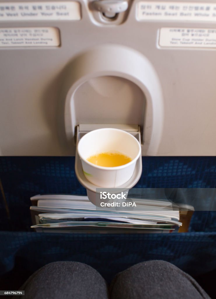 Airplane Seat Cup Holder With Drink Stock Photo - Download Image Now - Air  Vehicle, Airplane, Airplane Seat - iStock