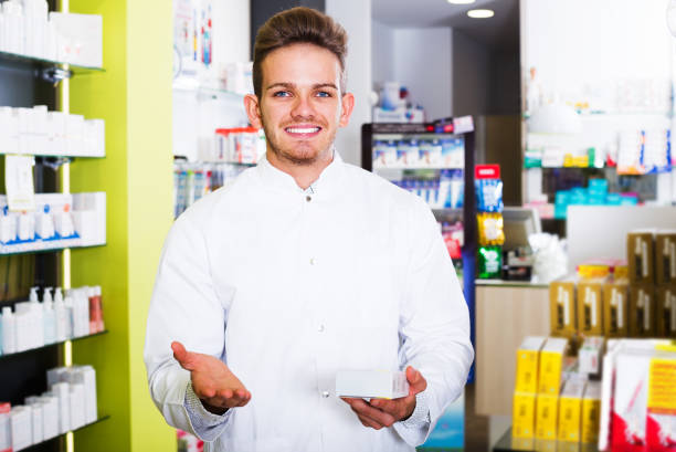 istock Man druggist in pharmacy 684799530