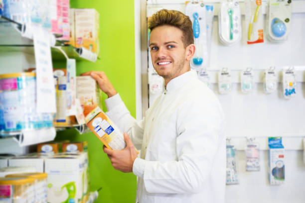 istock Man druggist in pharmacy 684799560