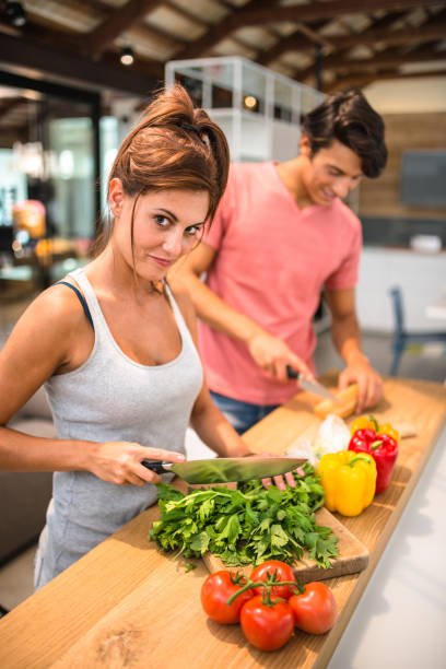 istock couple preparing food togetherness 684802992