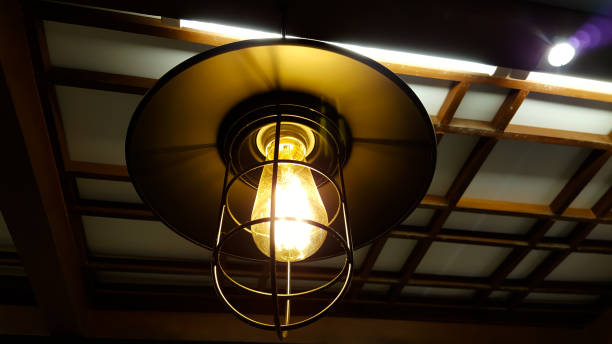 istock Old dusty light bulb glowing in the dark 684803022