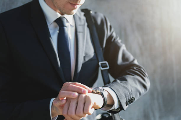 istock A businessman setting time on the watch 684806900