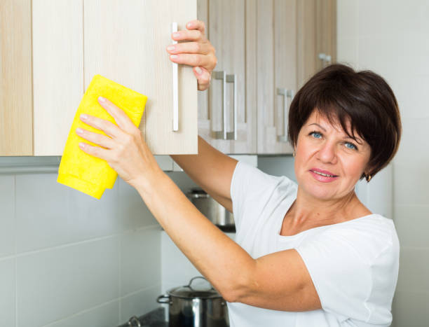 istock senior woman cleaning 684807372