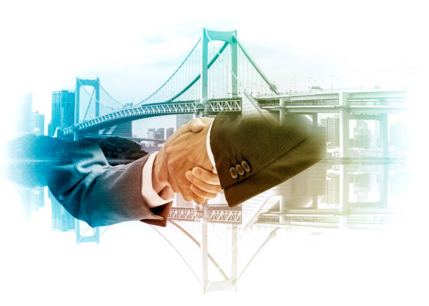 istock Double exposure of two business persons shaking hands and bridge skyline, relationship conceptual abstract 684807676