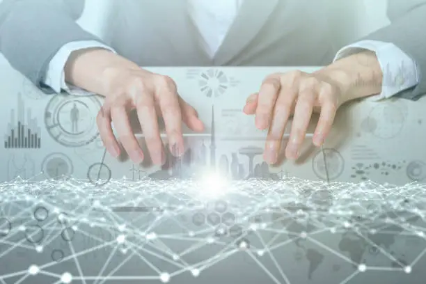 Photo of woman looks transparent monitor panel that indicates technological graphics IoT(Internet of Things), ICT(Information Communication Technology), digital transformation, abstract image visual