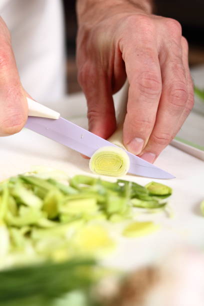 istock Slicing Leek. Making Potato and Leek Filo Pie. Series. 684810446
