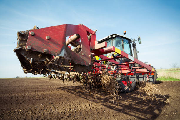 istock Farmer in tractor preparing land with seedbed cultivator in early spring 684811382