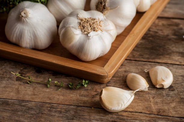 istock Organic garlic on a wooden table in the background .Rustic style. 684814594