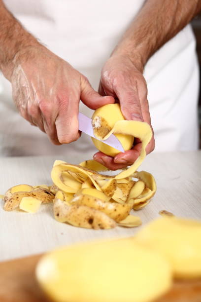 istock Peeling potato. Making Potato and Leek Filo Pie. Series. 684817262