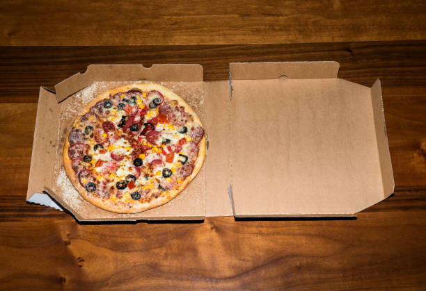 istock Delicious pizza and wooden background 684820092