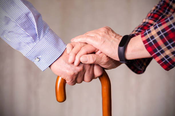 istock Senior couple holding hands on crutch 684822730