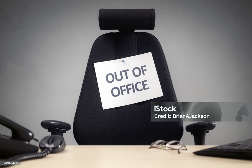 Business chair with out of office sign Business chair with out of office sign concept for vacation, holiday, lunch break or work life balance After Work Stock Photo