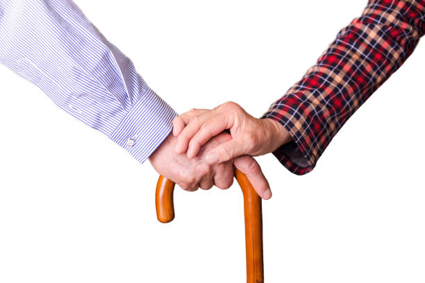 istock Senior couple holding hands on crutch 684823470