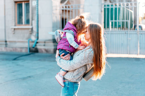 istock Mother holds a small daughter in her arms 684826814