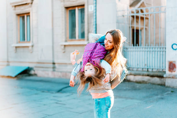 istock Mom and girl playing, having fun 684827266
