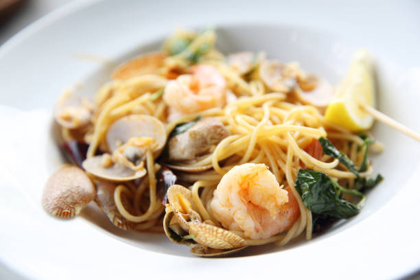 istock Seafood pasta Spaghetti with Clams, Prawns, Italian food 684833574
