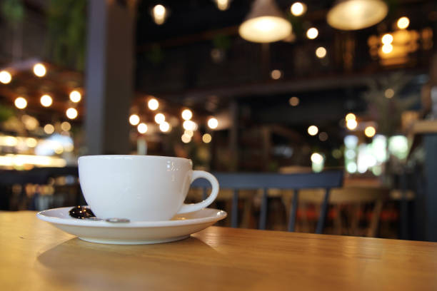 istock cappuccino coffee on wood background 684833894