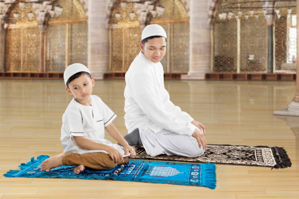istock Family praying together in the mosque 684834368