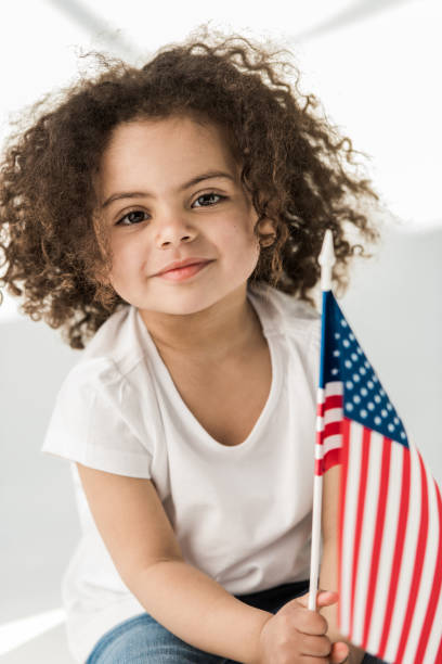 istock baby girl with american flag 684837808