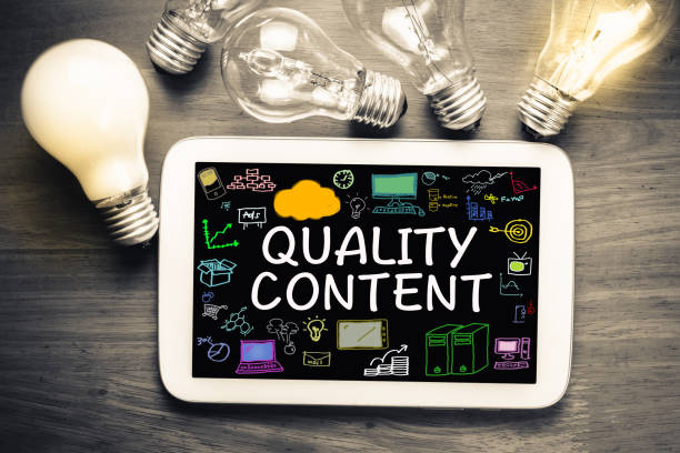 Quality Content Quality Content concept on tablet with glowing light bulbs Quality Content stock pictures, royalty-free photos & images