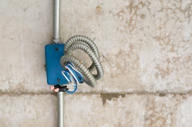 istock Electric cable prepare for plug in at concrete wall. 684841392