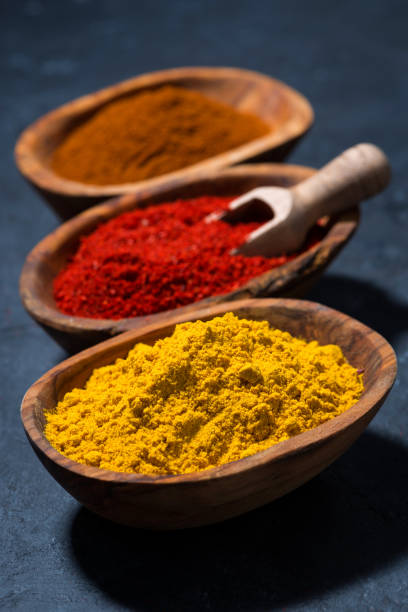 istock ground spicy paprika, turmeric and red pepper, vertical 684841820