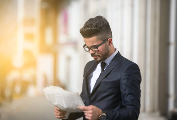 istock Businessman reading newspaper 684842088