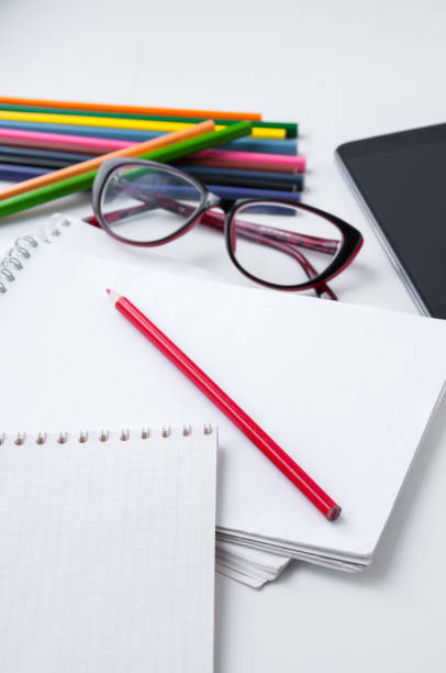 istock Business still-life, glasses, smart phone, notebook and colored pencils 684848458