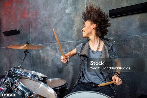 Portrait Of Emotional Woman Playing Drums In Studio Drummer Rock Concept Stock Photo - Download Image Now