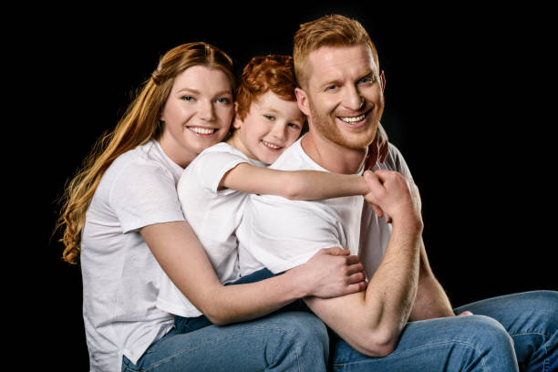 family in white t-shirts hugging each other 
