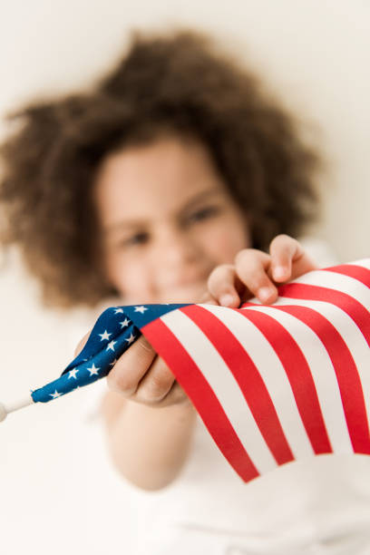 istock baby girl with american flag 684873530