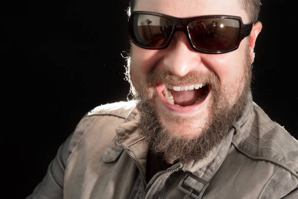 istock Handsome bearded man in sunglasses emotional portrait 684873842