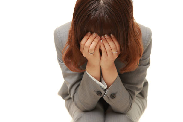 young businesswoman depressed portrait of young businesswoman depressed against white background 仕事 stock pictures, royalty-free photos & images