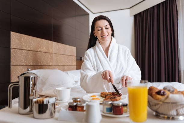 istock Joyful happy woman holding a knife 684876832