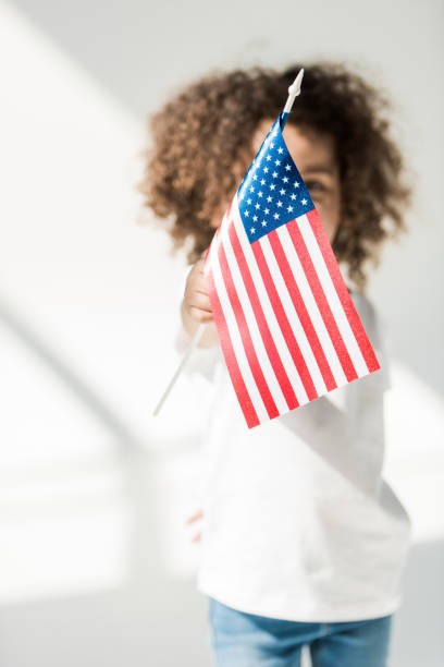 istock baby girl with american flag 684877178