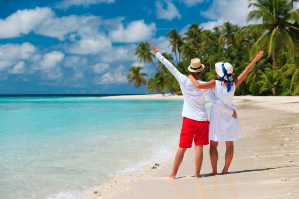 istock happy loving couple on tropical beach 684880244