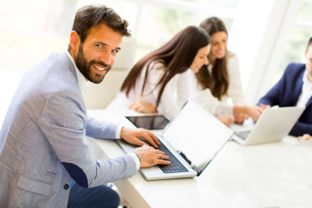 istock Modern businessman with laptop 684880600