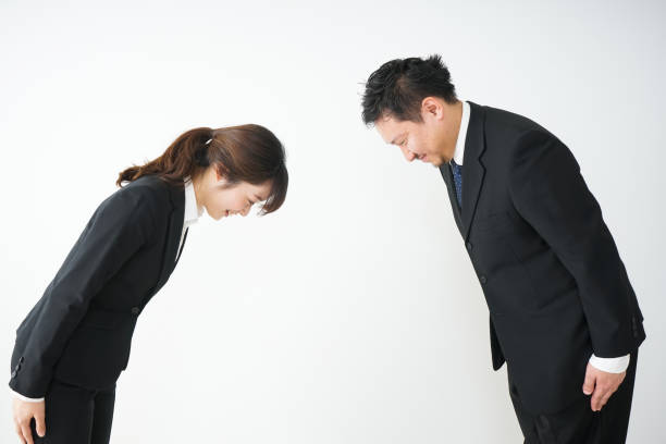 A bowing business person A bowing business person bowing stock pictures, royalty-free photos & images