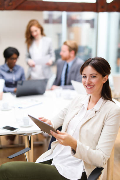 istock Young businesswoman using digital tablet in the office 684884320