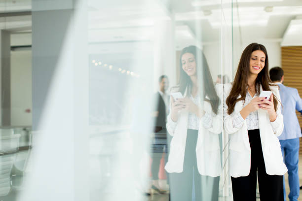 istock Young businesswoman with mobile phone 684887166