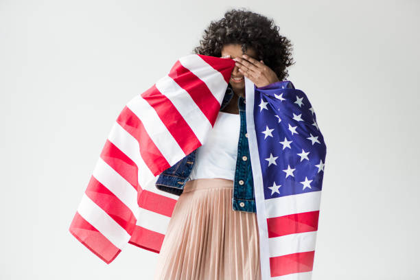 istock woman cowered with american flag 684887456
