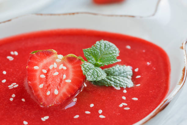 A bowl of strawberry soup gazpacho with mint. Healthy food.