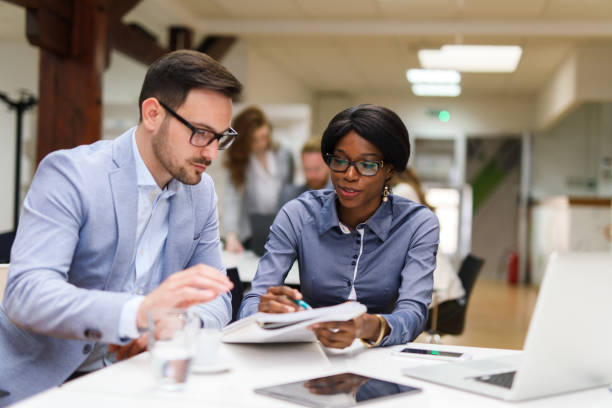 istock Business people reviewing business reports 684893266