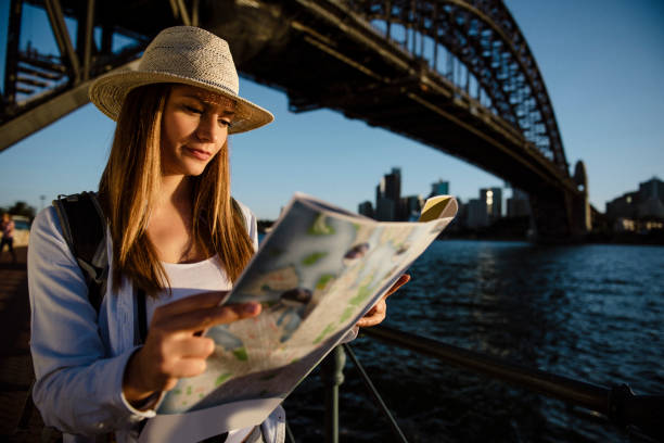 istock Young woman searching city map 684896854