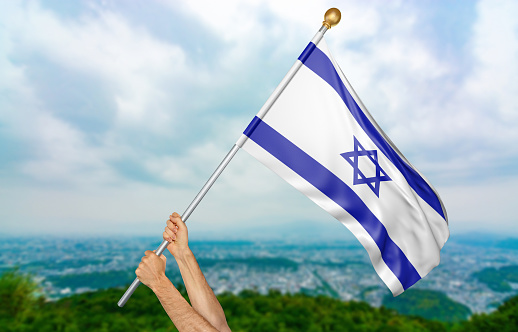 Man holding the national flag of Israel high in the air. The flag and pole have been realistically 3D rendered.