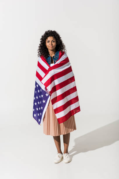istock woman cowered with american flag 684932892