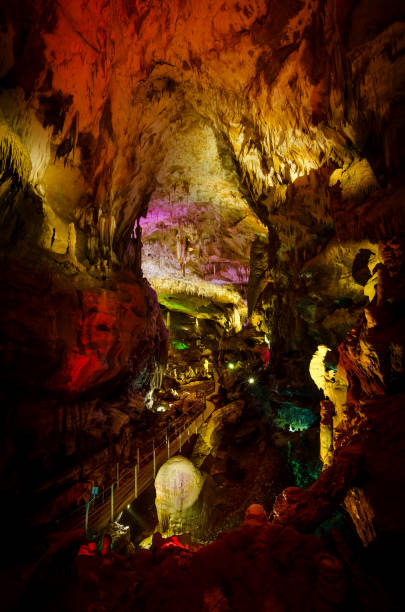 istock Beautiful illuminated multicolored cave and stalactites from karst Prometheus Cave. Georgia 684933110