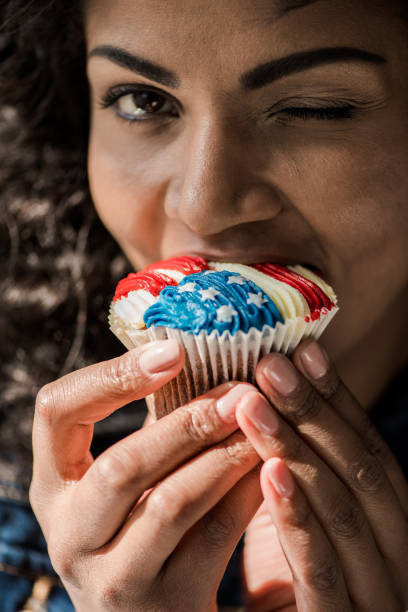 istock american girl bite cupcake 684935492