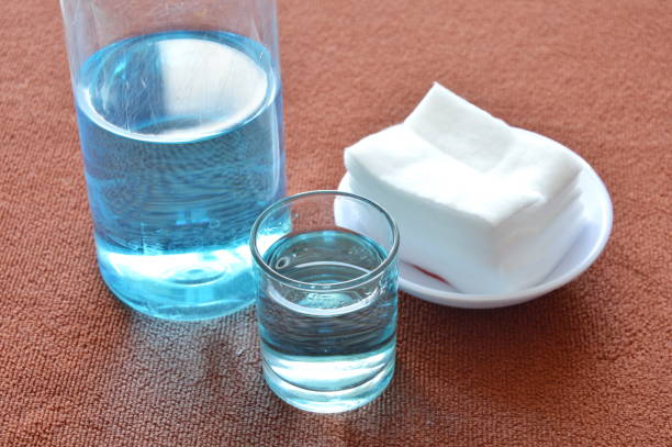blue alcohol for wash wound in glass and cotton blue alcohol for wash wound in glass and clean white cotton hydrogen peroxide stock pictures, royalty-free photos & images